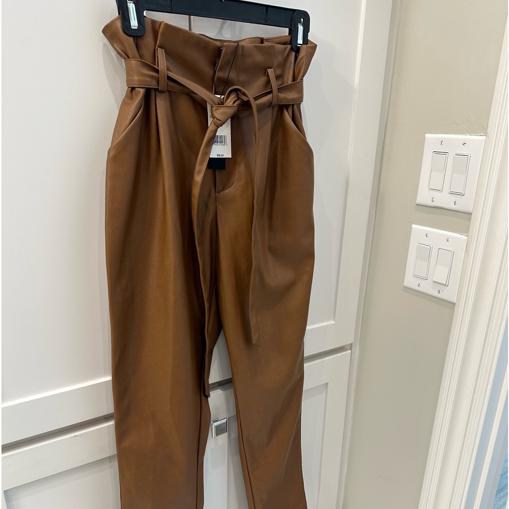 NWT size small faux leather tapered pants in Cognac! Perfect for the fall!